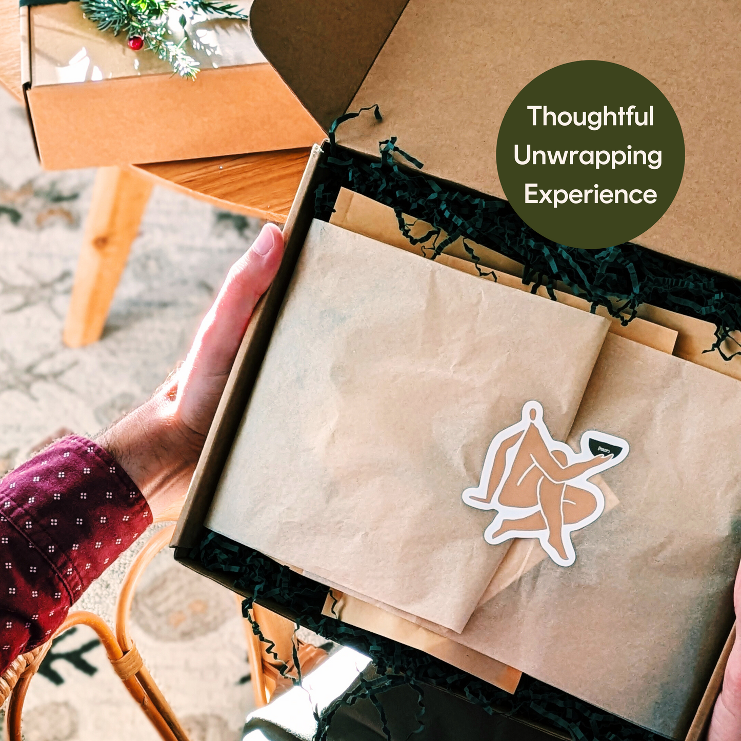 person holding a holiday gift box